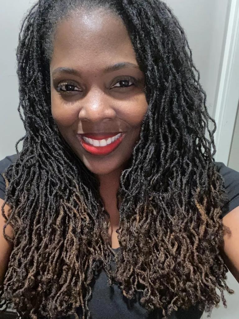 Long black and brown locs with red lipstick