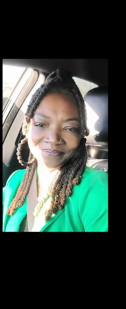 Long silver and grey locs with glasses