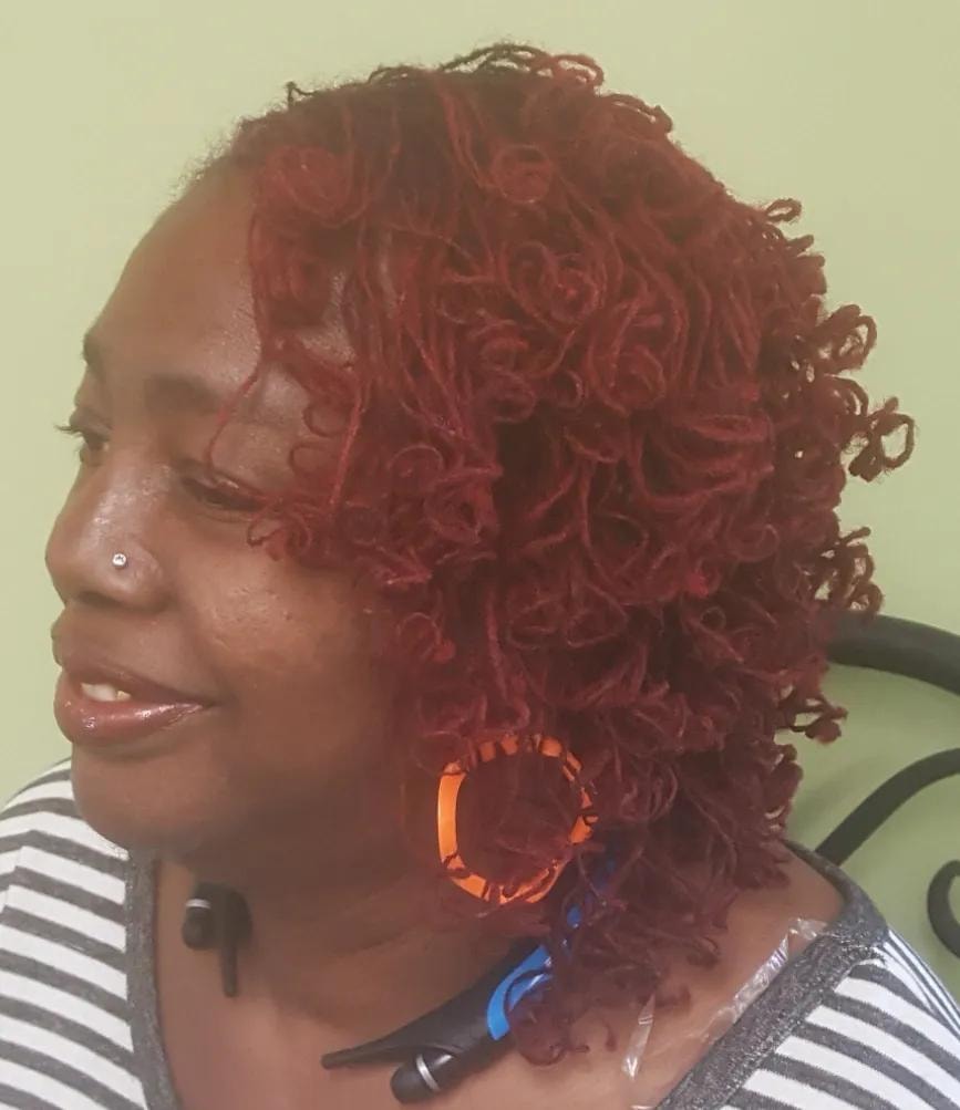 Golden loc updo styled outdoors
